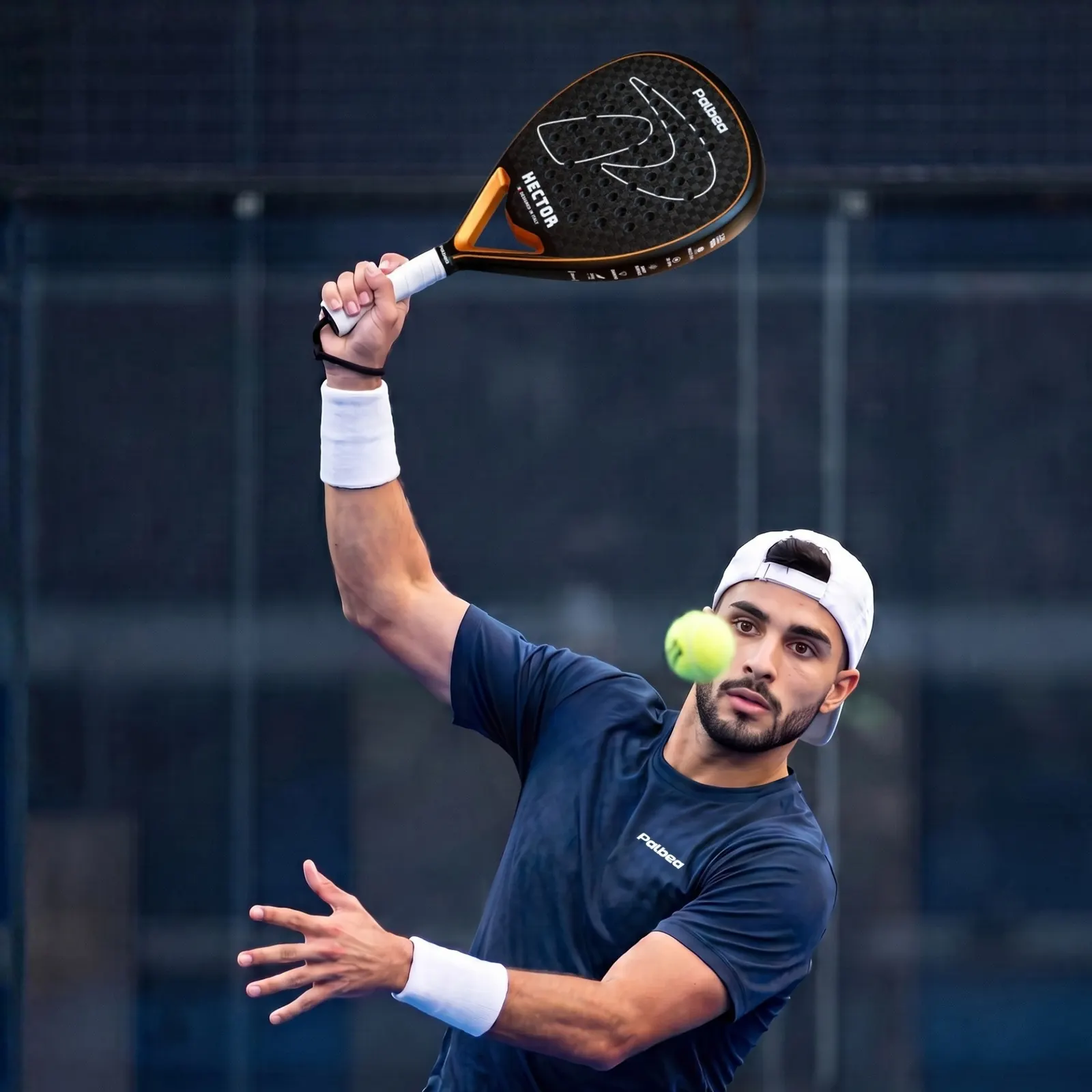 Player hitting a smash with the HECTOR racket