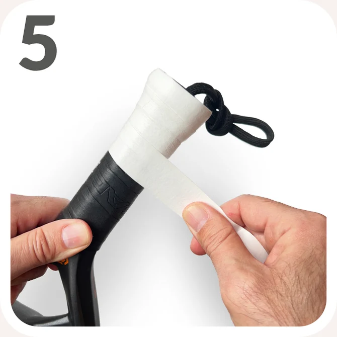 Step 5 — Continue wrapping upwards, overlapping the overgrip by about 50% on each turn.