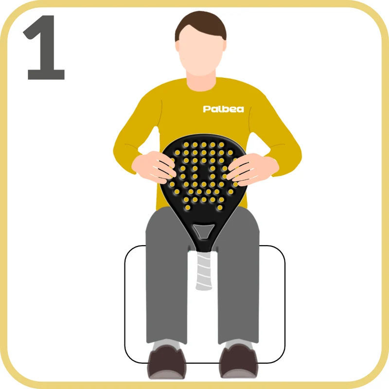 Step 1 — Sitting down, place your padel racket with the handle between your knees and the head of the racket facing up.