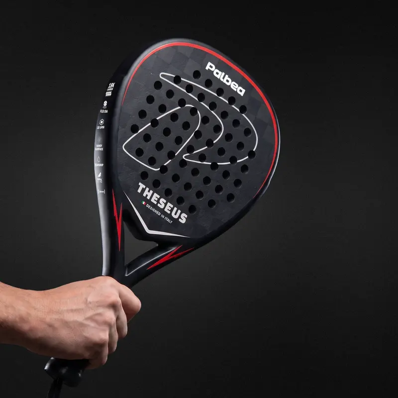 Hand holding a Palbea racket, handle detail